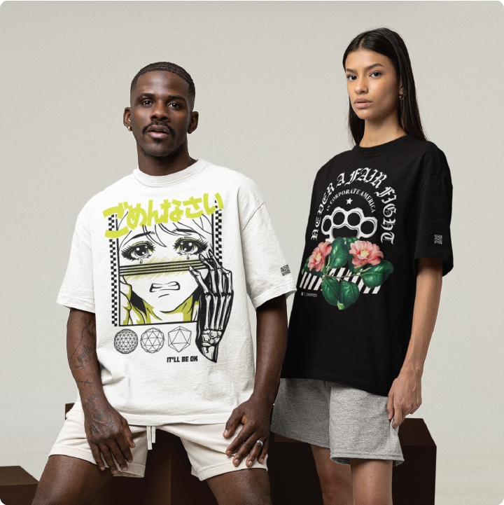 Two models pose in graphic t-shirts. The left model wears a white shirt with an anime design; the right model wears a black shirt with roses and a text design. They stand against a neutral backdrop.